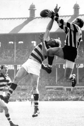 Mick Twomey (Collingwood) taking a mark against Geelong during the  1953 Grand Final.