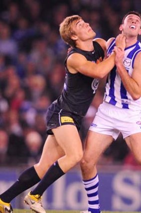 Ill-matched: Carlton defender Matthew Watson battles with North's Todd Goldstein in the ruck.