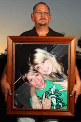 Shaun Taylor Breeze with a portrait of Krystal and Nathan  Breeze.