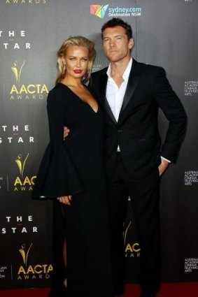 Back to business as usual: Lara Bingle and Sam Worthington.