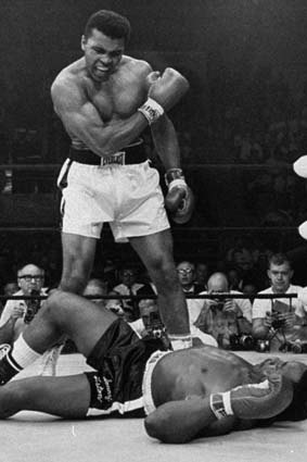 Iconic: Cassius Clay stands over fallen challenger, Sonny Liston.