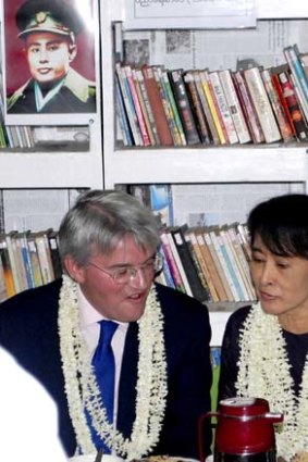 Isolation ends ... Aung San Suu Kyi talks to a visiting British MP, Andrew Mitchell, at an education centre near Rangoon.