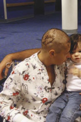 The comeback … Samantha, 11 days after the attack, with husband Laurence and daughter Lily.