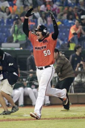 Cult hero Jack Murphy shows his elation after hitting an eighth-inning grand slam.