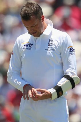 Graeme Swann of England looks at his finger during day three of the Third Ashes Test Match between Australia and England at the WACA.
