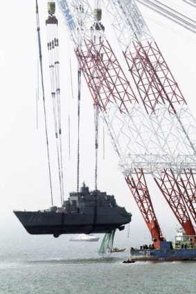 Suspicious sinking ... a crane salvages part of the South Korean ship Cheonan.