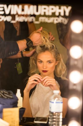 A model has her hair done backstage at Melbourne Spring Fashion Week.