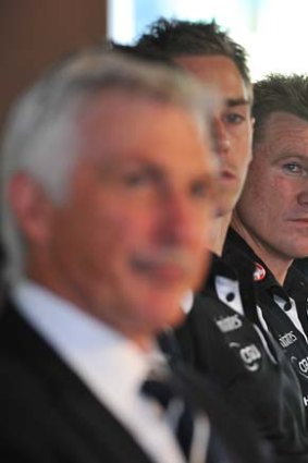 Polite but restrained. Carlton coach Mick Malthouse and Collingwood coach Nathan Buckley at the Peter Mac breakfast.