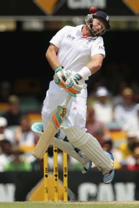 Ian Bell of England evades a short pitched ball from Mitchell Johnson at the Gabba.