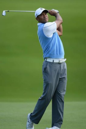 Swinger: Tiger Woods practises before the PGA.