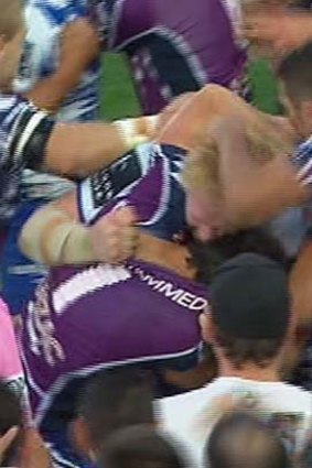 Oh no: James Graham seems to bite Billy Slater.
