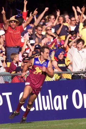 Past glory: Ex-star Daniel Bradshaw delights his home crowd at the Gabba in 2002.