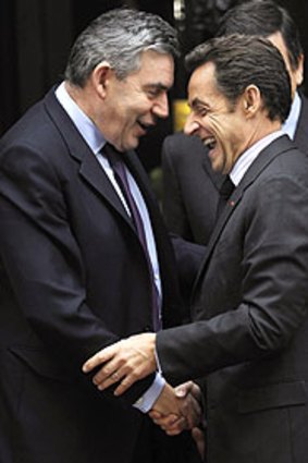 Opposites attract: Gordon Brown greets Nicolas Sarkozy at 10 Downing Street.
