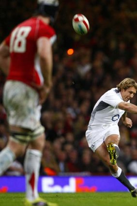Jonny Wilkinson kicks a penalty goal that stretched England's lead in the dying minutes.
