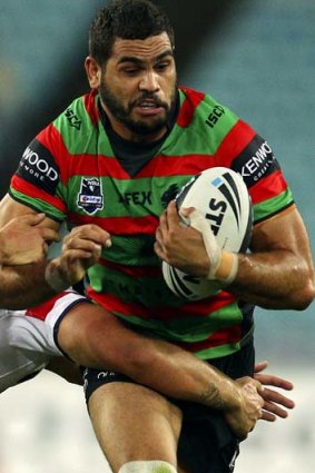 Frustrated &#8230; Greg Inglis is tackled against the Roosters.