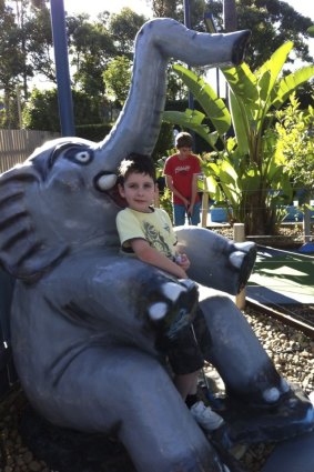 Family day out: A local boy takes a breather on the Jungle Trail at Ermington Putt Putt.