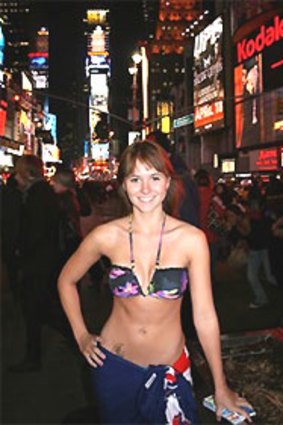 Hailey Turner stripped down to a bikini in Times Square on her quest to win Tourism Queensland's island caretaker job.