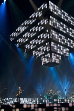 What looks like an inverted pyramid descends from the ceiling in the Muse concert in Sydney on Friday night.