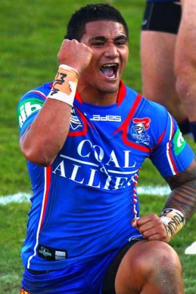 Peter Mata'utia  of the Knights celebrates his try.