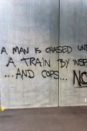 Some of the graffiti left at North Melbourne station overnight.