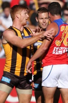 Lion Tom Rockliff remonstrates with Kyle Cheney and Sam Mitchell.