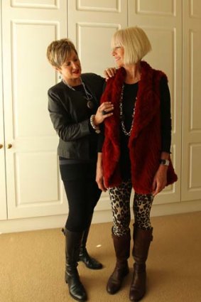 Suzy Black, Personal Shopper and Stylist giving client Carol Turner, 53 a wardrobe make-over in her home. Photo shows Suzy styling Carol in a day time outfit.