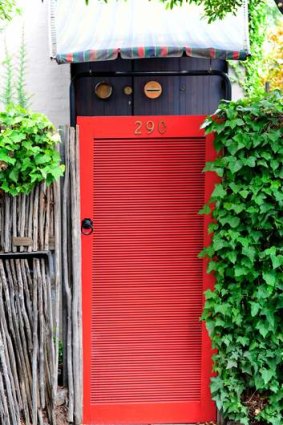 Red gate at the former South Yarra home of Robin Boyd.