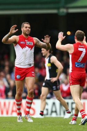 Six more points: Lance Franklin celebrates a goal against St Kilda.