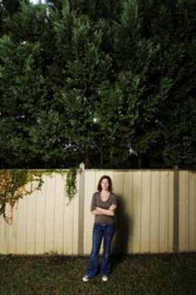 Tired of having her views blocked ... Julie Giannesini, of Mosman, and the 12-metre hedge along her northern boundary.