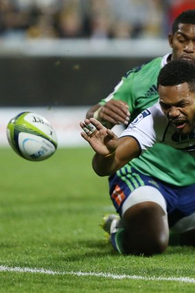 Henry Speight of the Brumbies drops the ball while attempting to score a try.