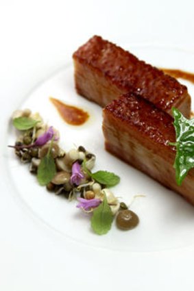 Berkshire pork belly: scallion soubrise, market radish, char siu glaze.