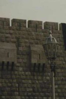A pre-Baathist Syrian flag, a symbol of the uprising, is seen for the first time at the top of Damascus Castle.