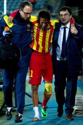 Neymar Jr. of FC Barcelona leaves the pitch after picking up an injury during the Copa del Rey Round between Getafe CF and FC Barcelona.