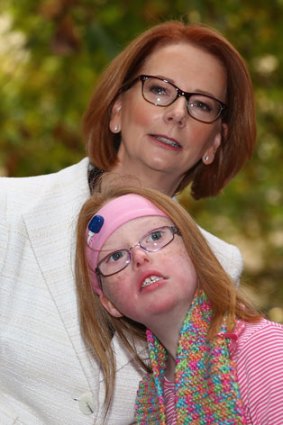 Julia Gillard meets Sophie Dean from the disabled community after a press conference at the Commonwealth Parliamentary office in May.