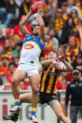 On the rise: Suns defender Campbell Brown marks the ball against Hawthorn's Liam Shiels at the MCG on Sunday.