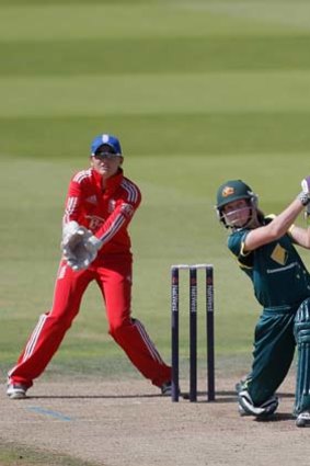 Meg Lanning of Australia hits out watched by England wicketkeeper Sarah Taylor.