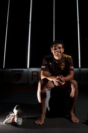 For the kids: Hawk Cyril Rioli is proud to support the campaign that will send footy boots to his community in the Tiwi Islands.