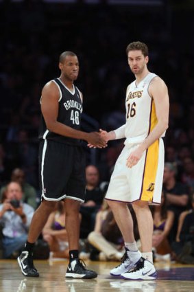 Brooklyn Nets recruit Jason Collins and Pau Gasol shake hands in the second half at Staples Center.