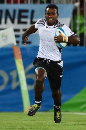 Jerry Tuwai of Fiji scores a try during the Men's Rugby Sevens Gold medal final match.