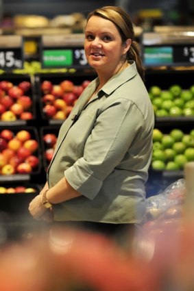 Safeway employee Fiona Smith, with a baby due in September, is "pleasantly surprised" by Woolworths'  paid maternity leave.