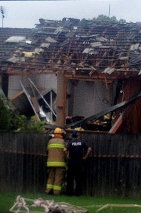 Crews investigate damage after an explosion at a Southport house.