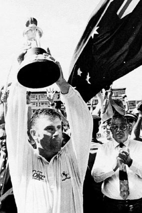 Mark Taylor holds up the Frank Worrell Trophy after his side defeated the West Indies in the Fourth Test and win the 1995 series.
