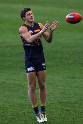 Murray Newman marks the ball during a West Coast Eagles AFL training session.