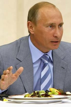 Cautious eater: Russian Prime Minister Vladimir Putin.