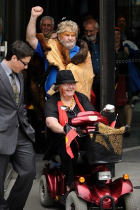 Elated: Claimants Geoff Clarke and Pat Eatock, seated, celebrate the victory.