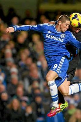 Fernando Torres of Chelsea wins a header against Crystal Palace.