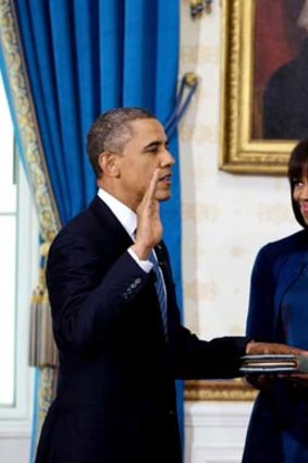 New look ... the attention was on Michelle Obama and her new haircut while Barack Obama took the oath of office on Sunday.