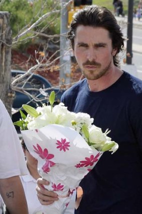 Actor Christian Bale visits survivors of the shootings.