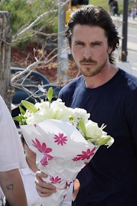 Actor Christian Bale visits survivors of the shootings.