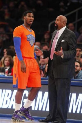Iman Shumpert  talks with Knicks coach Mike Woodson.